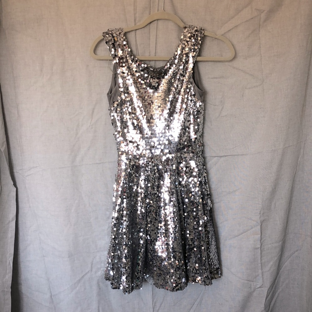 Short fun party dress, full silver sequins, zipper back.
